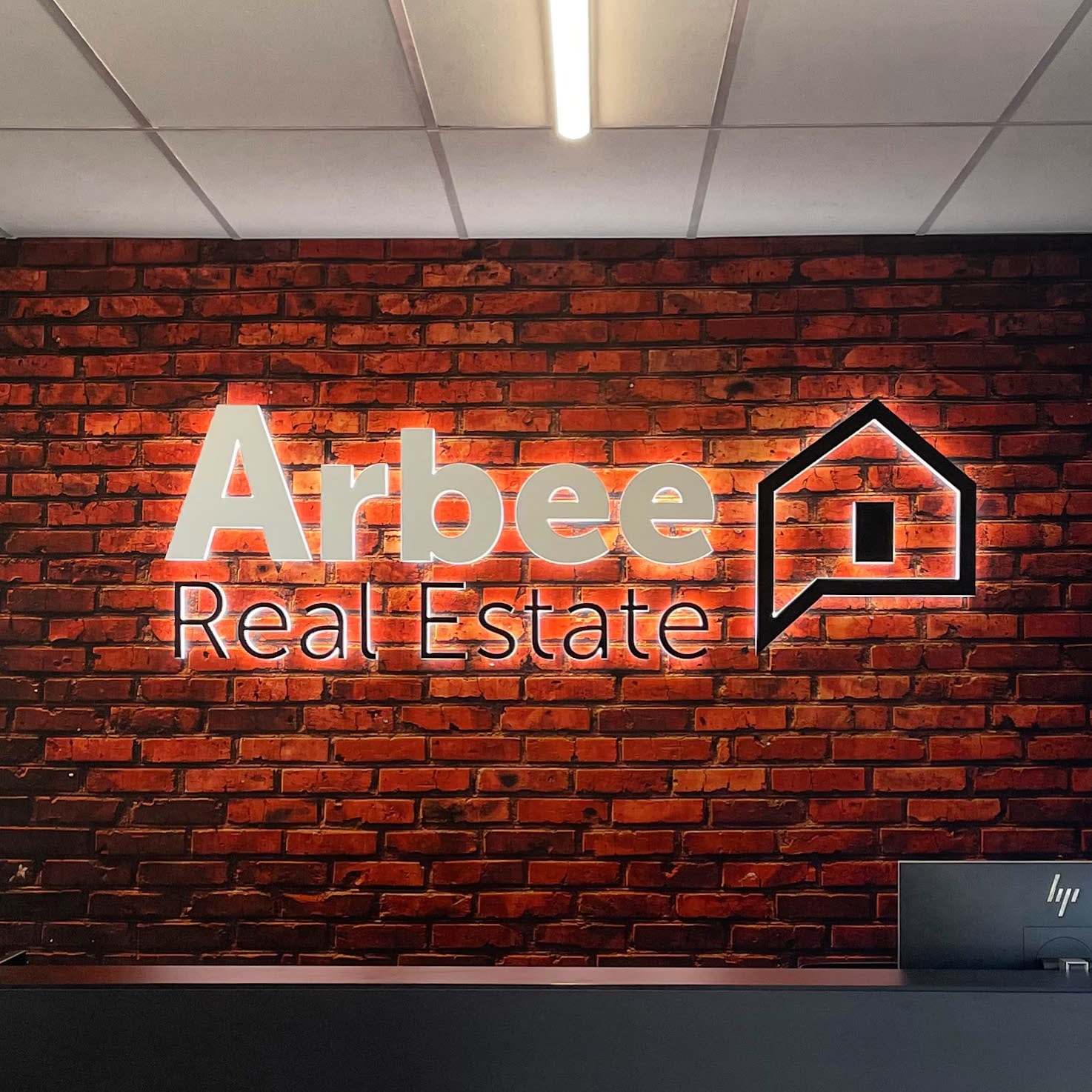 Branded reception sign in a professional Melbourne office